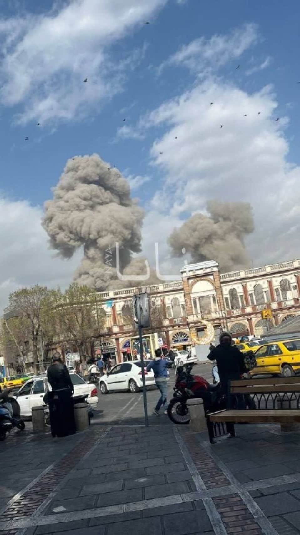 Massive smoke plumes rising over Imam Khomeini Square in Tehran following US and Israel Operation Shield of Judah strikes, February 28 2026
