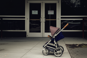 empty stroller outside private equity daycare center childcare crisis America