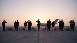 Six flag-draped coffins on tarmac representing US service members killed in the Iran war military class divide